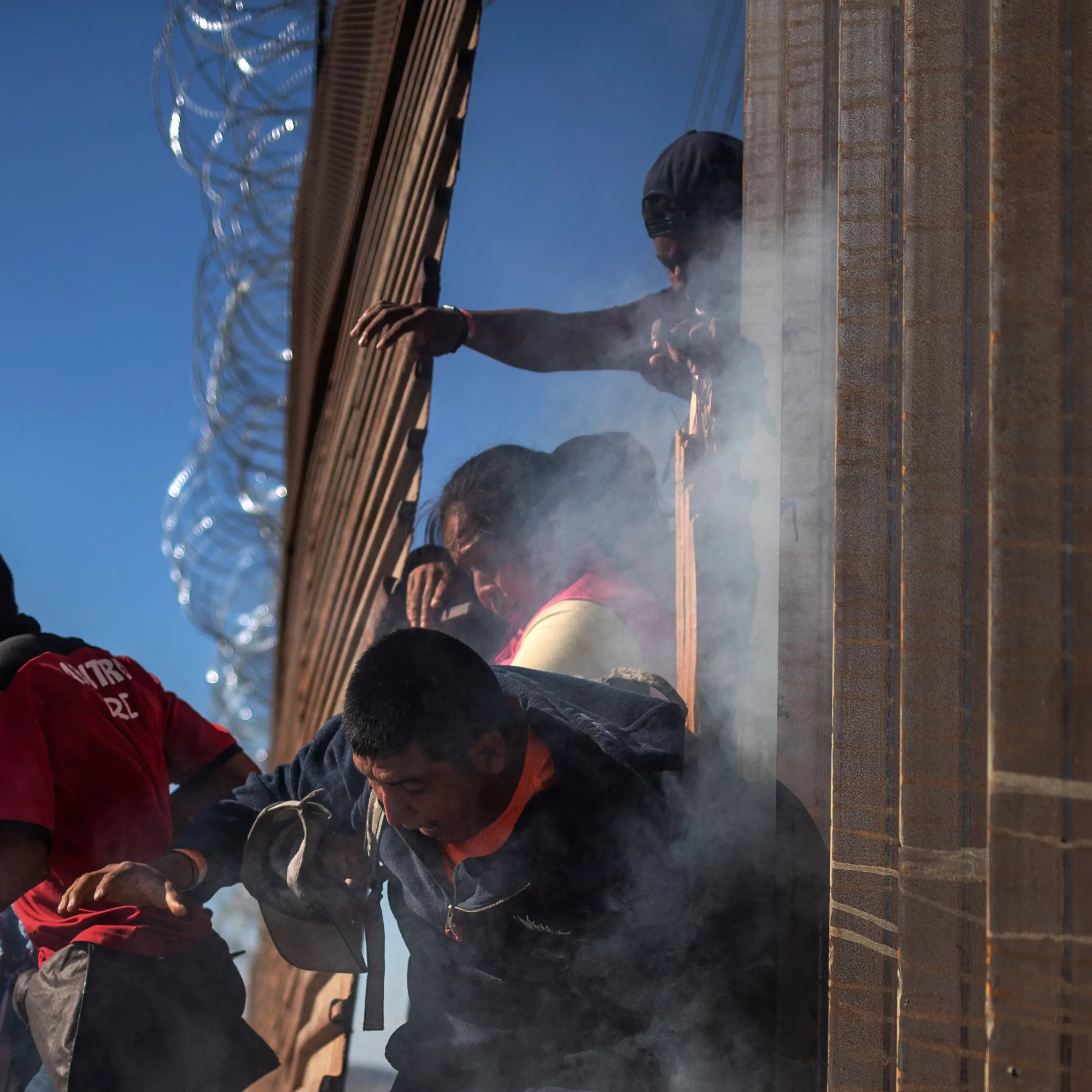 Mexican border crossing closed, migrants tear gassed