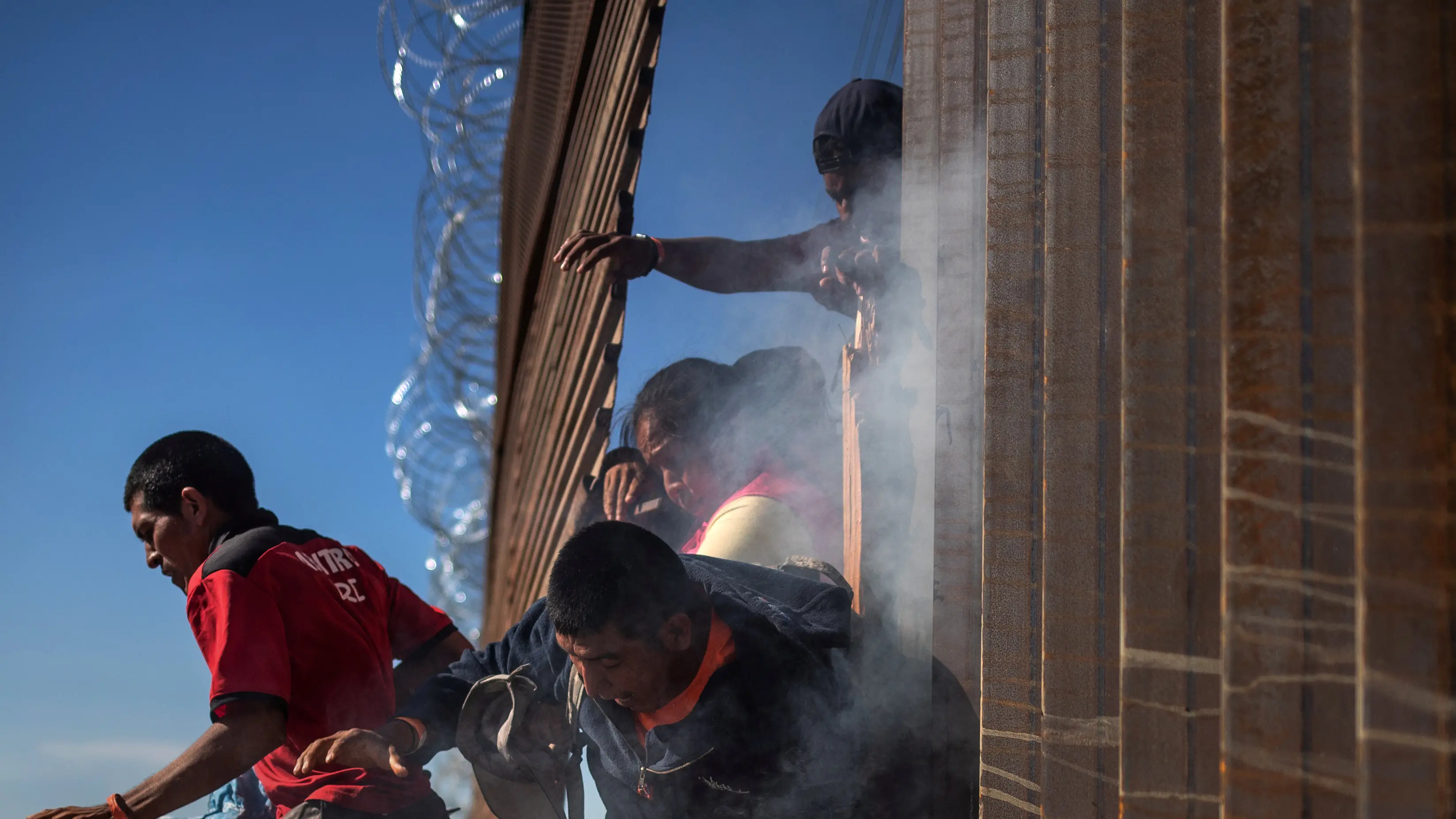 Mexican border crossing closed, migrants tear gassed