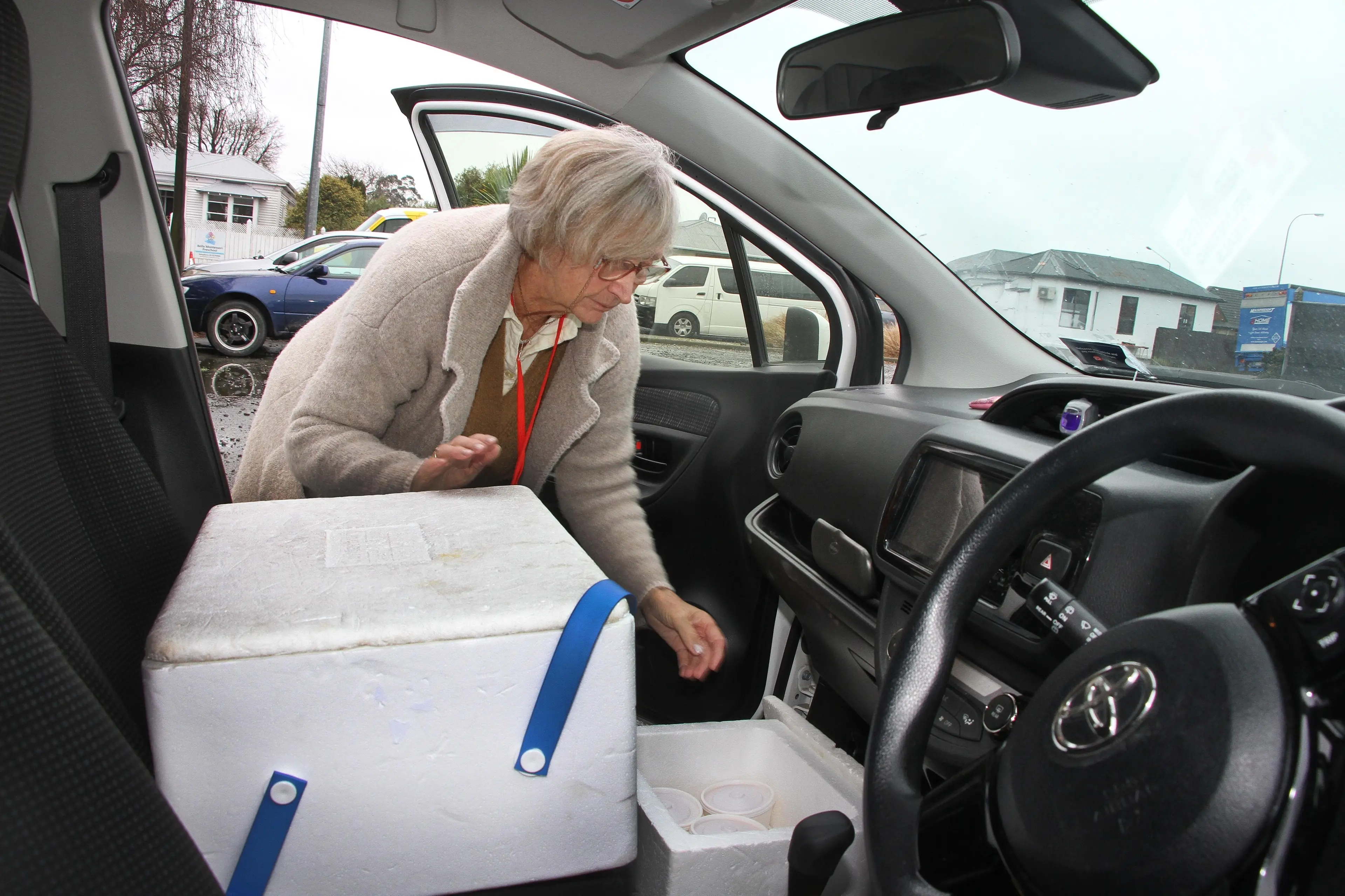 Red Cross Meals on Wheels delivery volunteer Shirley Ward, of Kaiapoi, checks the food packages are secure before she heads out to deliver the meals in Kaiapoi. Photo: John Cosgrove