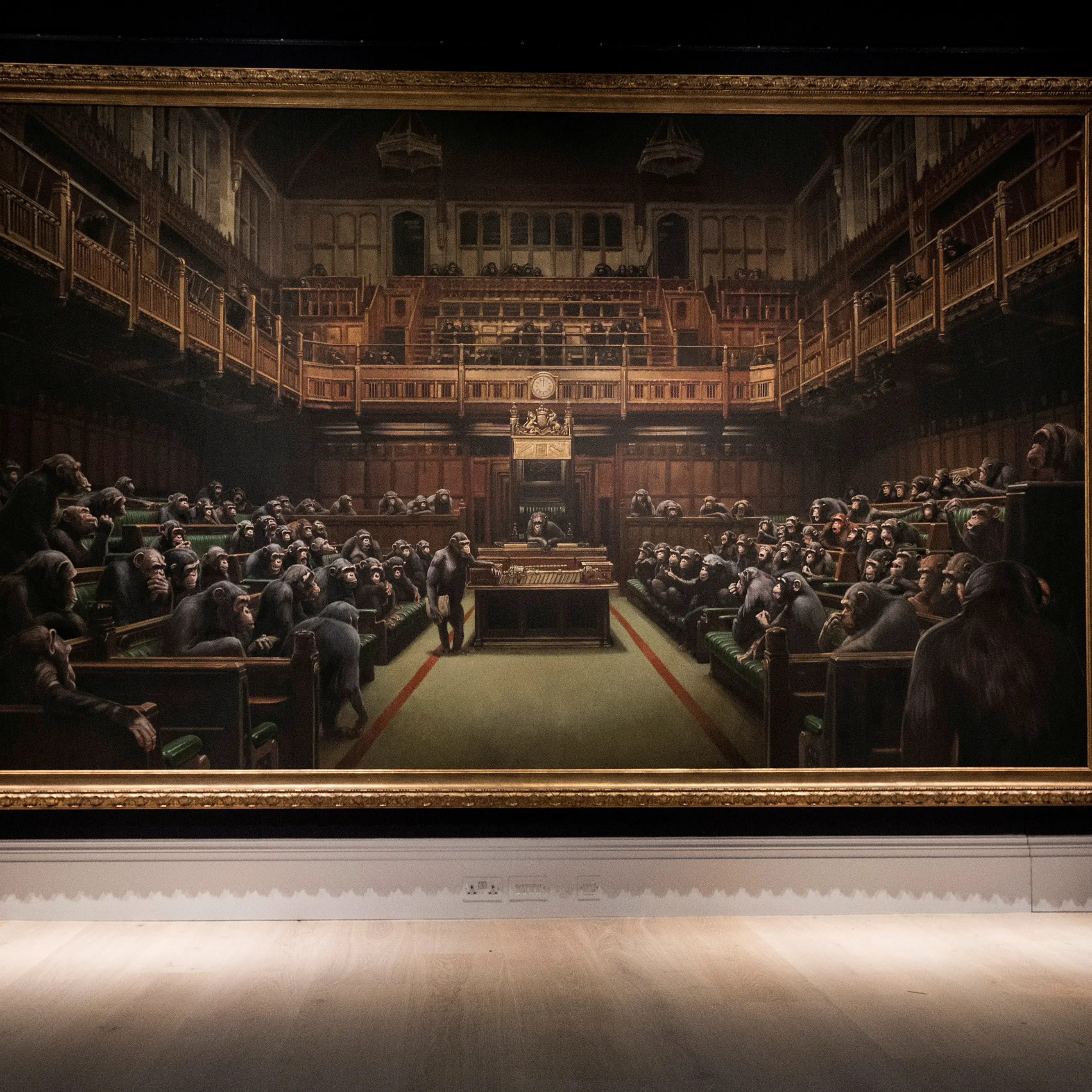 Banksy painting 'Devolved Parliament' sells for $19m
