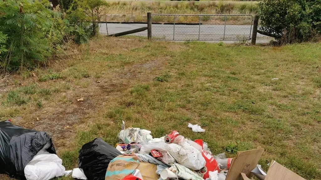 Fly-tippers warned: Residents make signs to stop people dumping rubbish in their Christchurch suburb