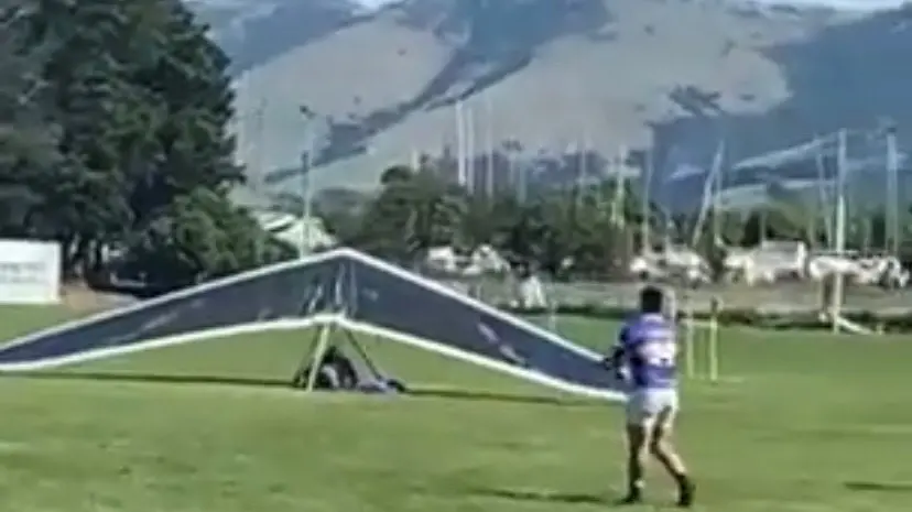 Crashing through the defence: Hang glider comes down in middle of rugby game