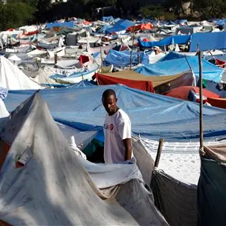 Haiti's homeless get tarps, want tents