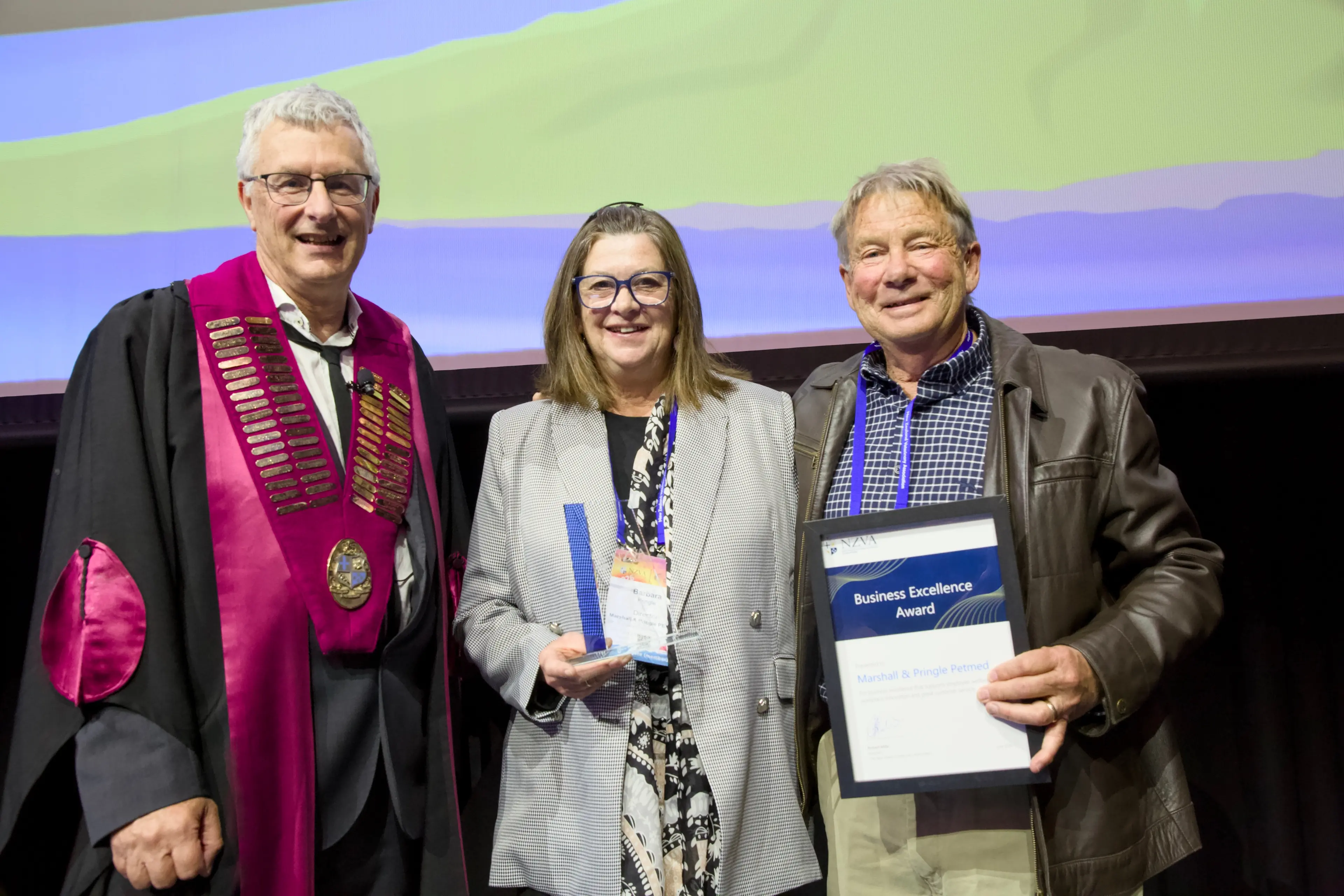 NZVA President Rob Mills presents Barbara and Murray Pringle with the 2026 Business Excellence Award at the annual New Zealand Veterinary Association (NZVA) awards. Photo: Supplied