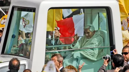 Tearful pope says church will better protect young