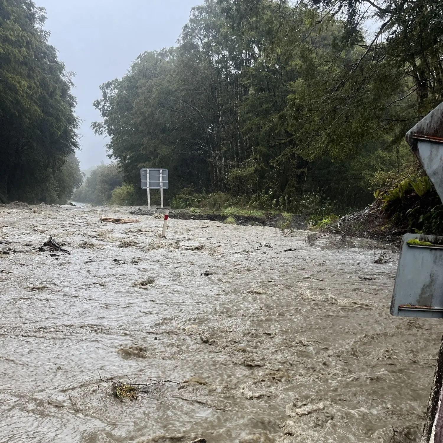 Flooding, slips cut off West Coast