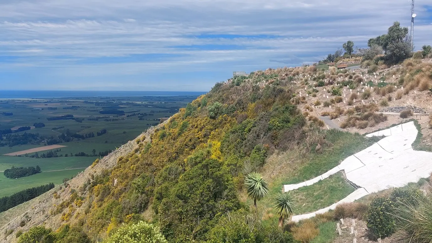 Flat out, like a horse on a hillside