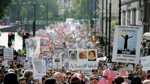 Pope meets abuse victims as thousands protest