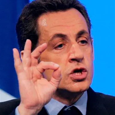 Sarkozy ends Olympic boycott threat