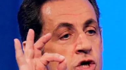 Sarkozy ends Olympic boycott threat