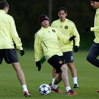 Football: Rooney to stay at Man Utd