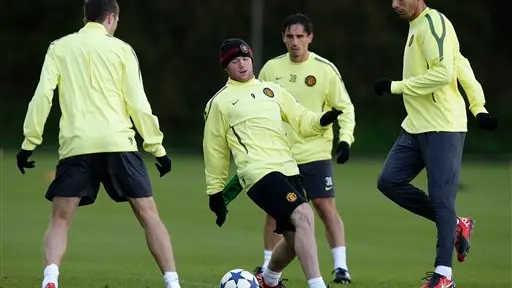 Football: Rooney to stay at Man Utd