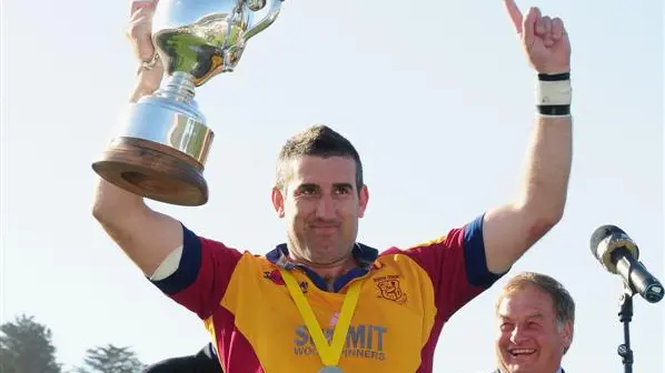 Rugby: Hands on cup, looking up
