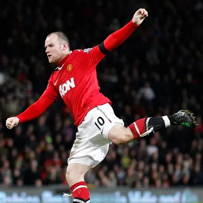 Football: Rooney bags two to keep Man United clear