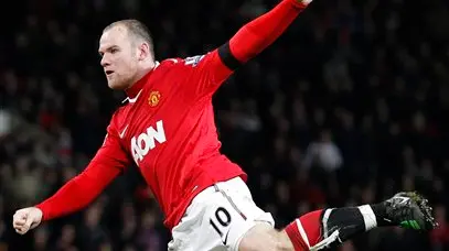 Football: Rooney bags two to keep Man United clear