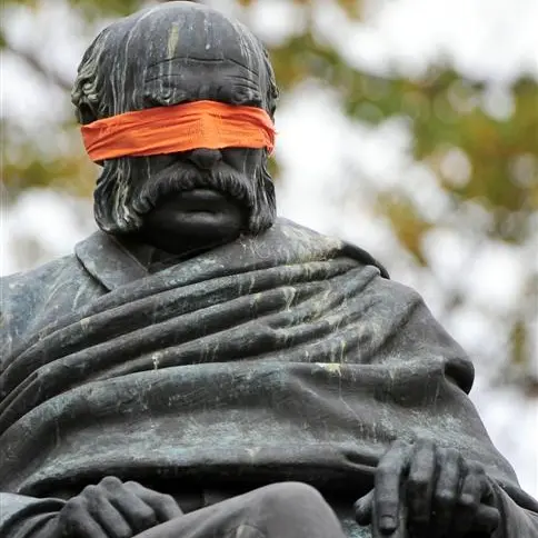 Blindfolding statues stunt to promote fringe festival