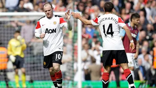 Football: Rooney hat-trick keeps Utd on track