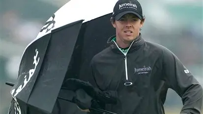 Golf: McIlroy's challenge washed away in rain