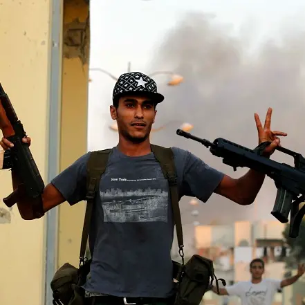 Bounty on Gaddafi's head as fight goes on