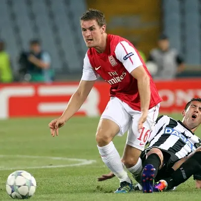 Football: Scrappy Arsenal ensure Champs League spot