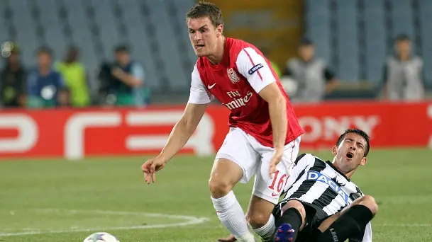 Football: Scrappy Arsenal ensure Champs League spot