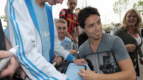 Football: Nasri signs on with Man City