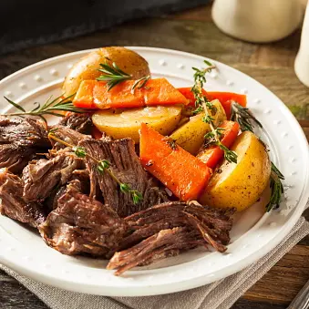 Hungry drunk driver found eating roast dinner behind wheel