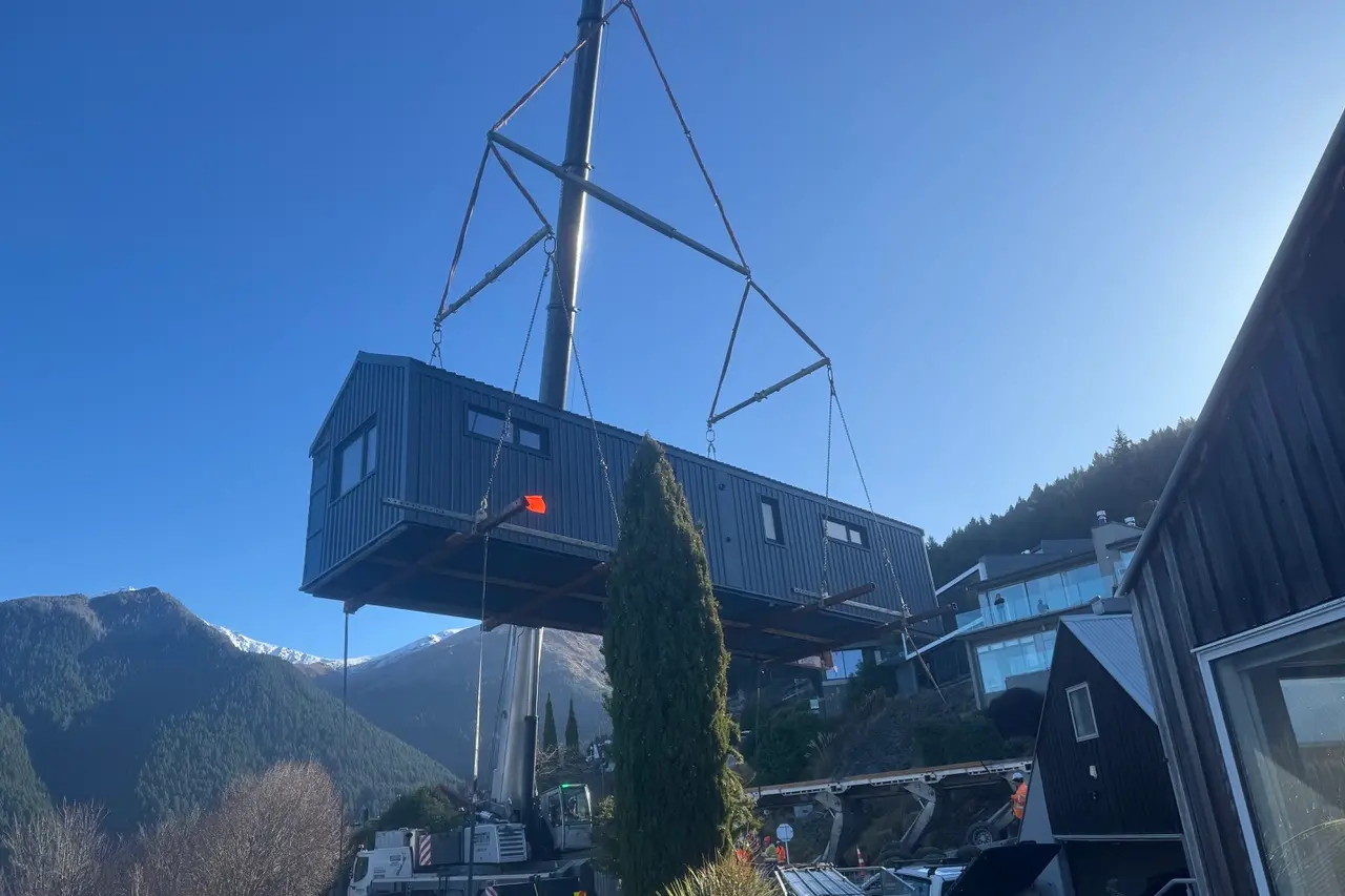 Moving experience: The back half of Cleone Blomfield\\u2019s new home being craned into place last Thursday. Photo: Supplied