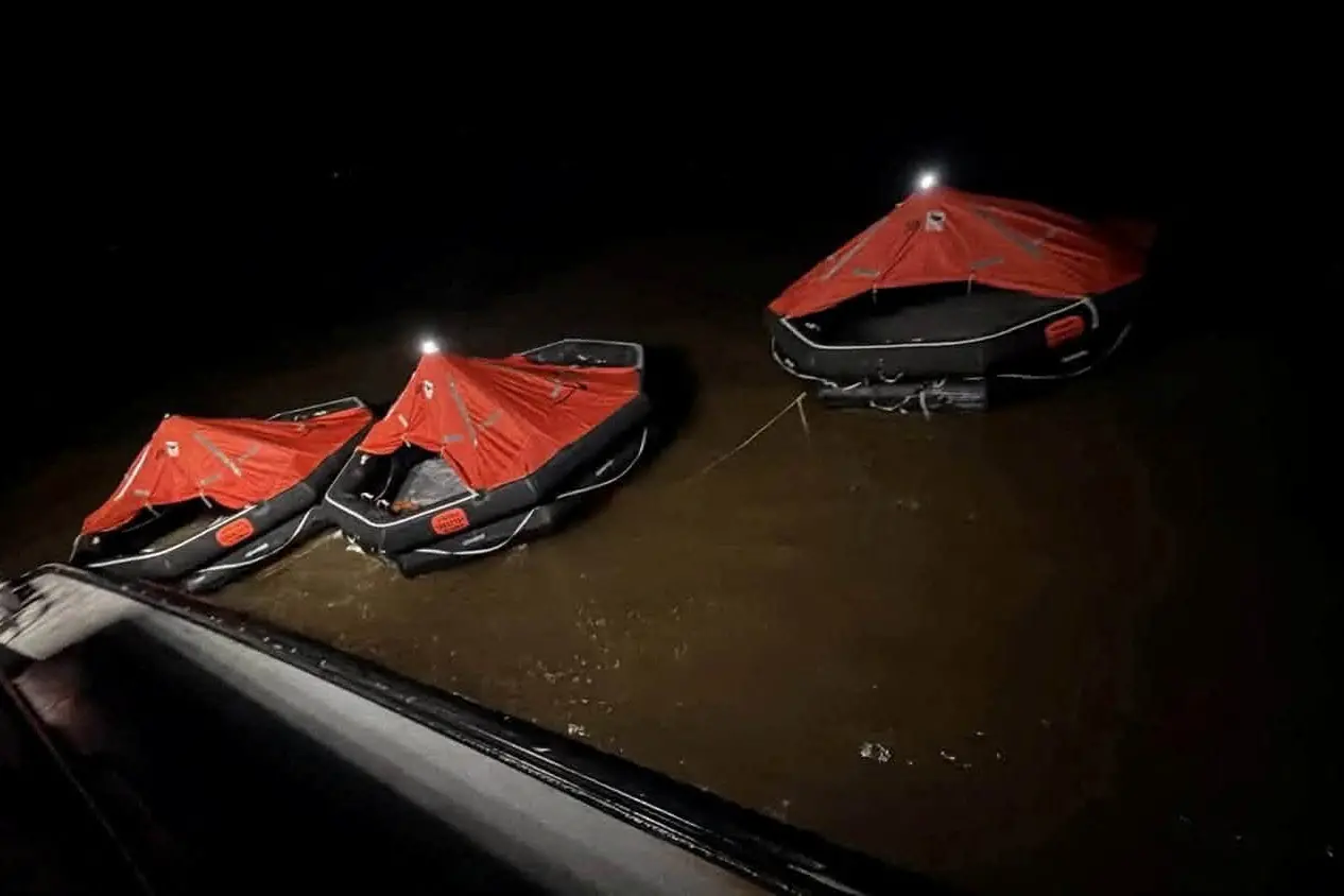 Lifeboats float on the water during search and rescue efforts after a ferry carrying passengers sank off the coast of Guyana in South America. Photo: Reuters