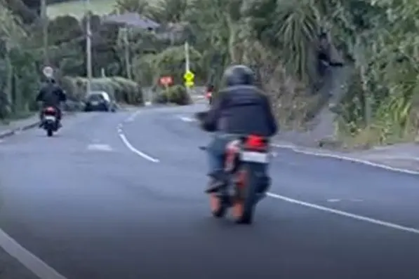 Stills from Irvine\\'s footage of motorcyclists and cyclists racing down Evans Pass Rd. Photo: Supplied