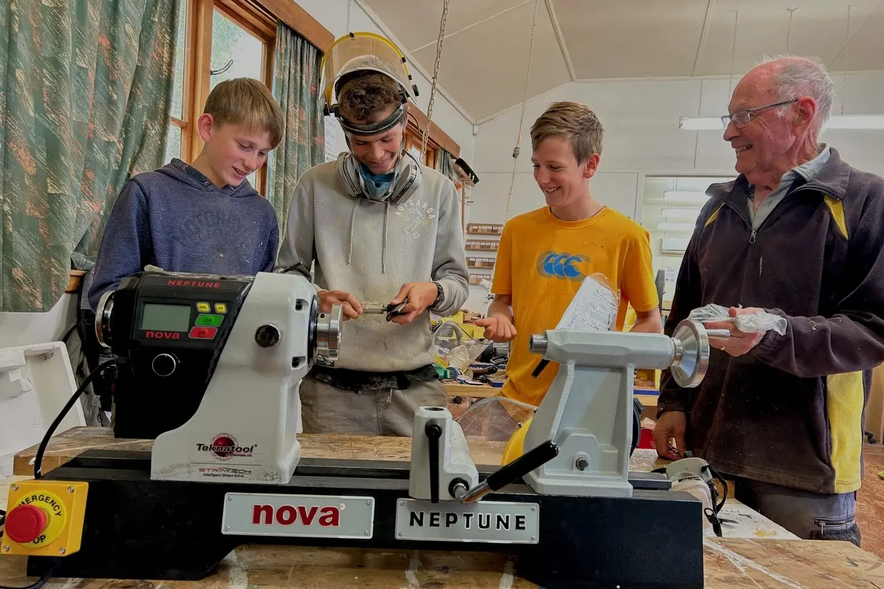 New beginnings . . . Harry Bagrie (left), Leonard Light, Felix Morton-Jones and tutor tutor Merv Laws, test one of the new lathes. Photo: Supplied