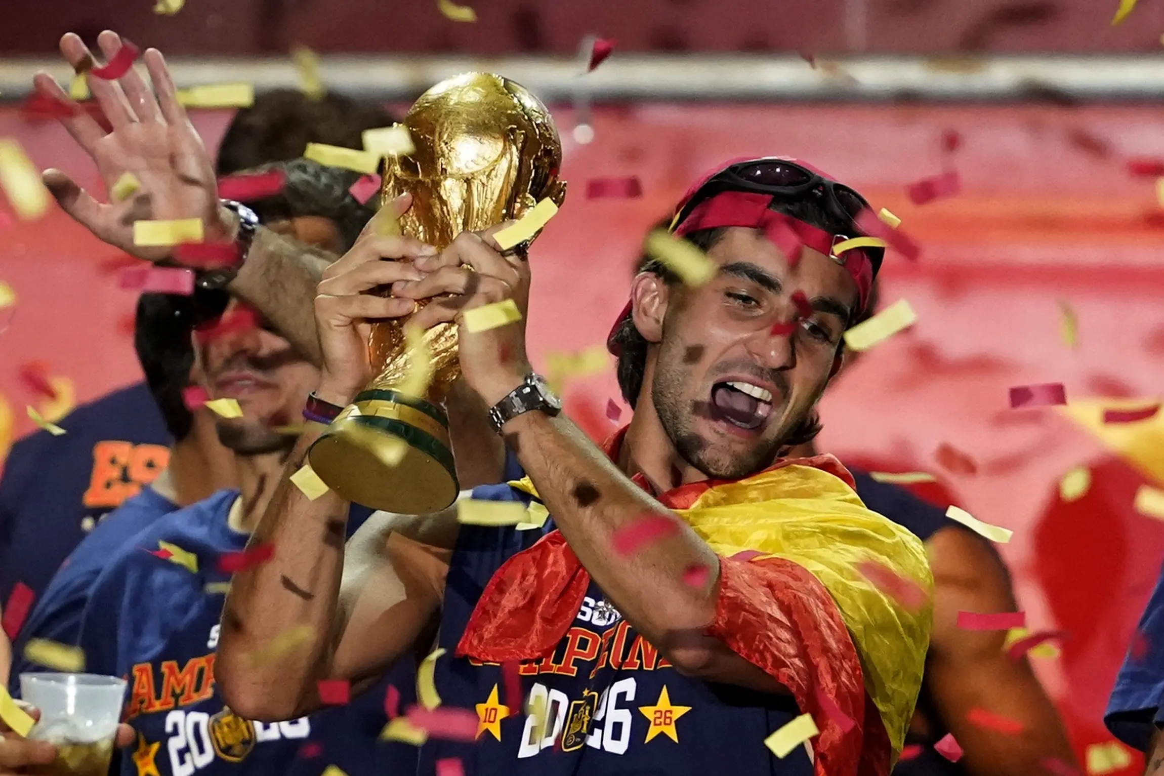World Cup final goal-scorer Ferran Torres celebrates with the trophy at Spain\\'s victory parade in Madrid. Photo: Reuters