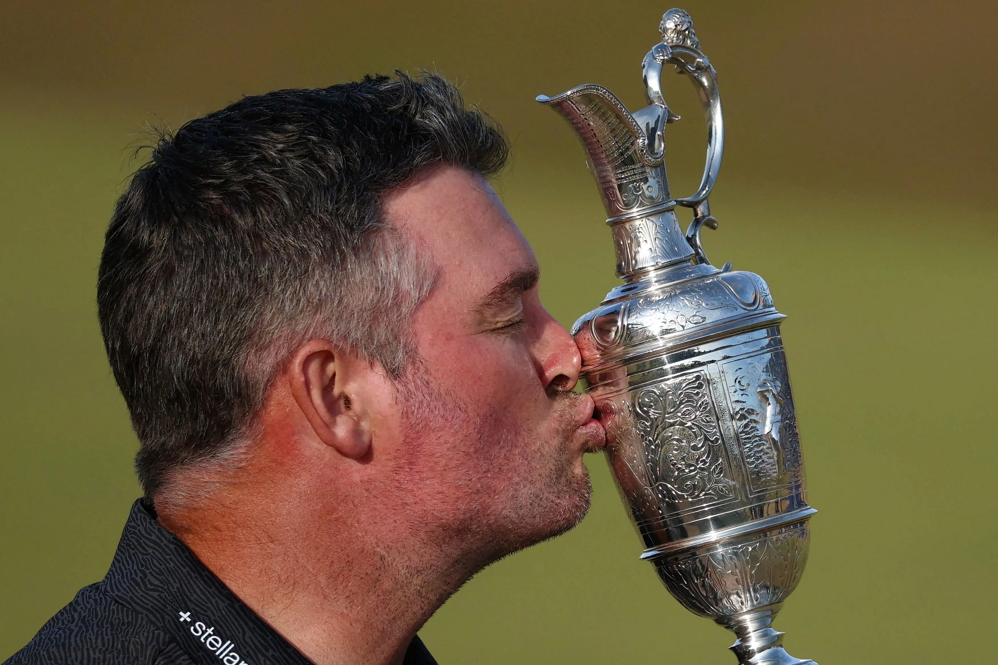 New Zealand golfer Ryan Fox celebrates with the Claret Jug after winning the British Open. Photo: Reuters