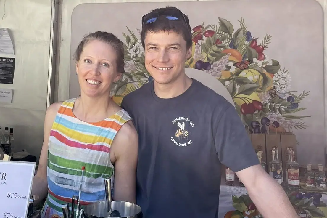 Saskia and Andrew Lewis serve up some of their award-winning gin earlier this year. Photo: Supplied