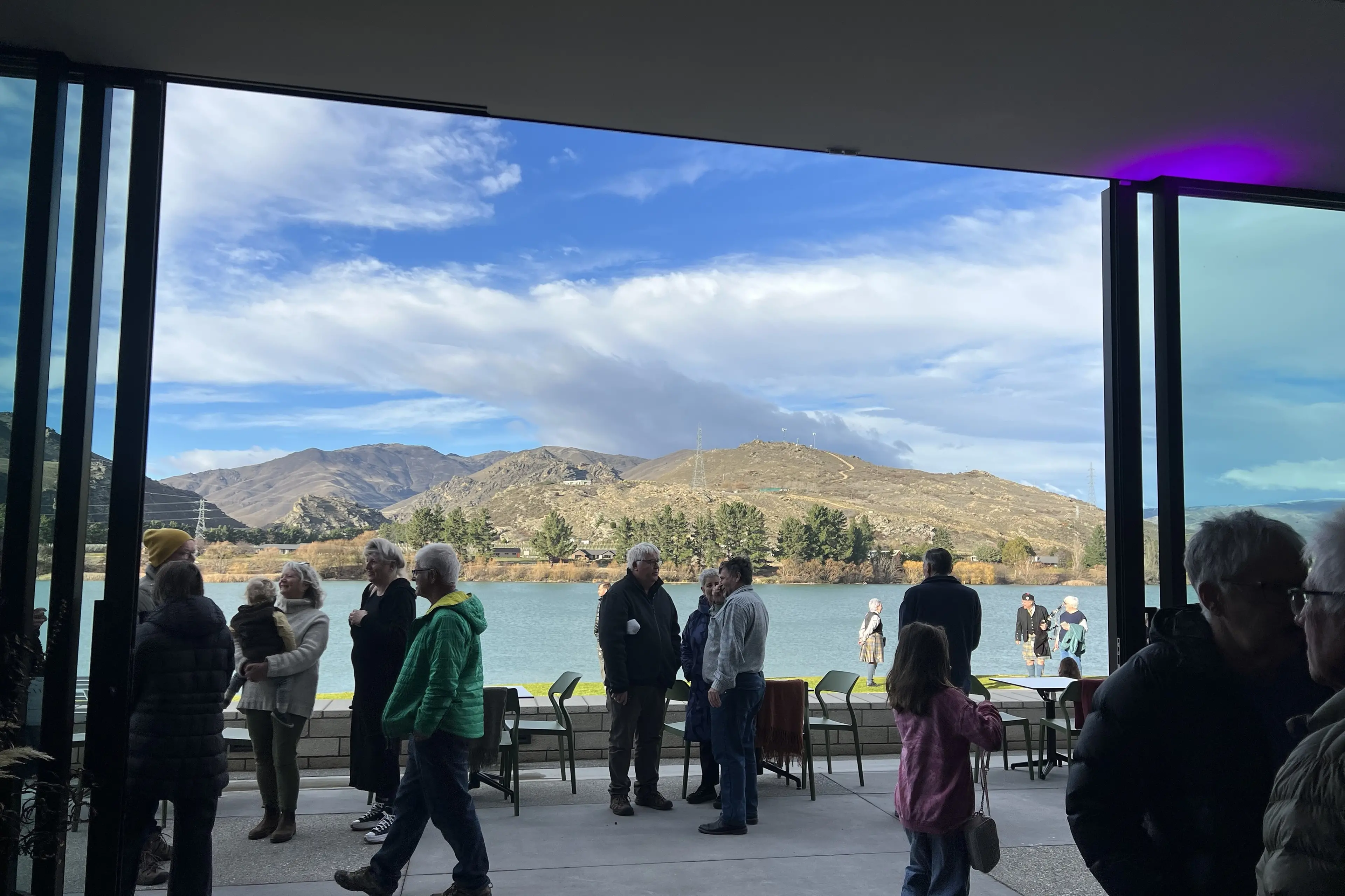 Visitors take in sweeping views of Cromwell Lake from inside the new Te Puna Mahara \\u2014 Cromwell Memorial Events Centre. Photo: Carys Trotter
