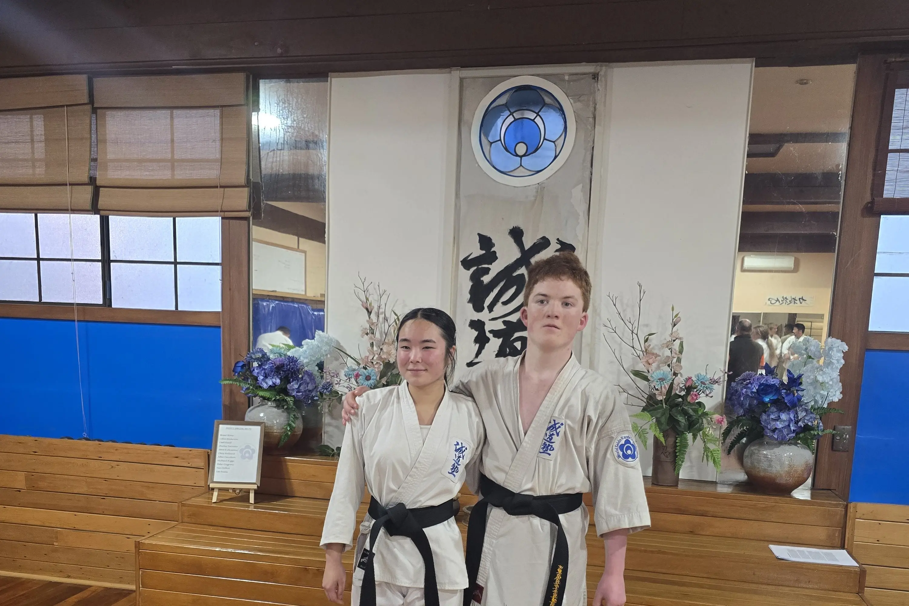 Grading together for their black belts were teenagers Yuna Gibson and Hunter Morris. Photo: Supplied