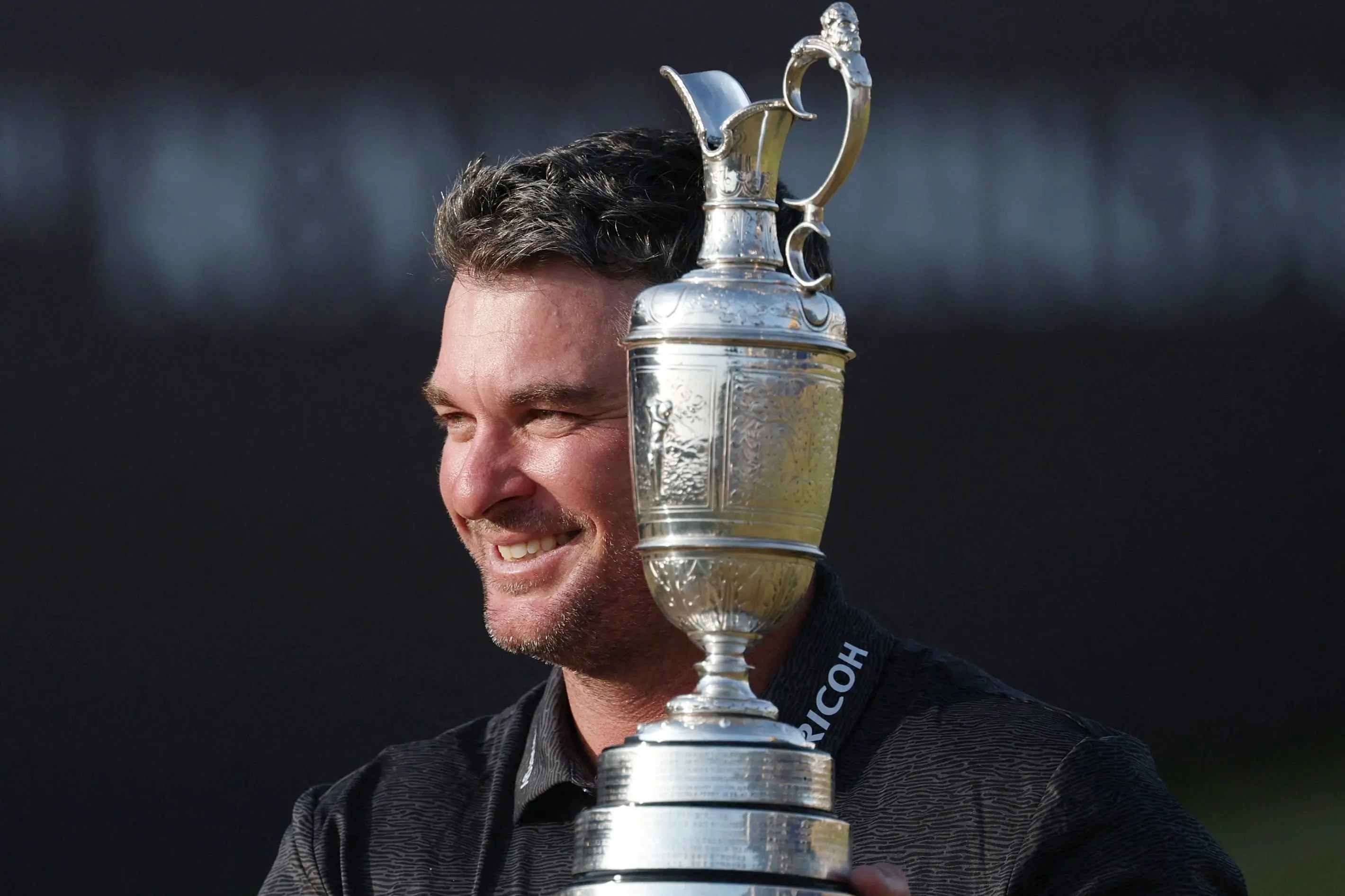 Ryan Fox celebrates with the Claret Jug after winning The British Open on Monday. Photo: Reuters