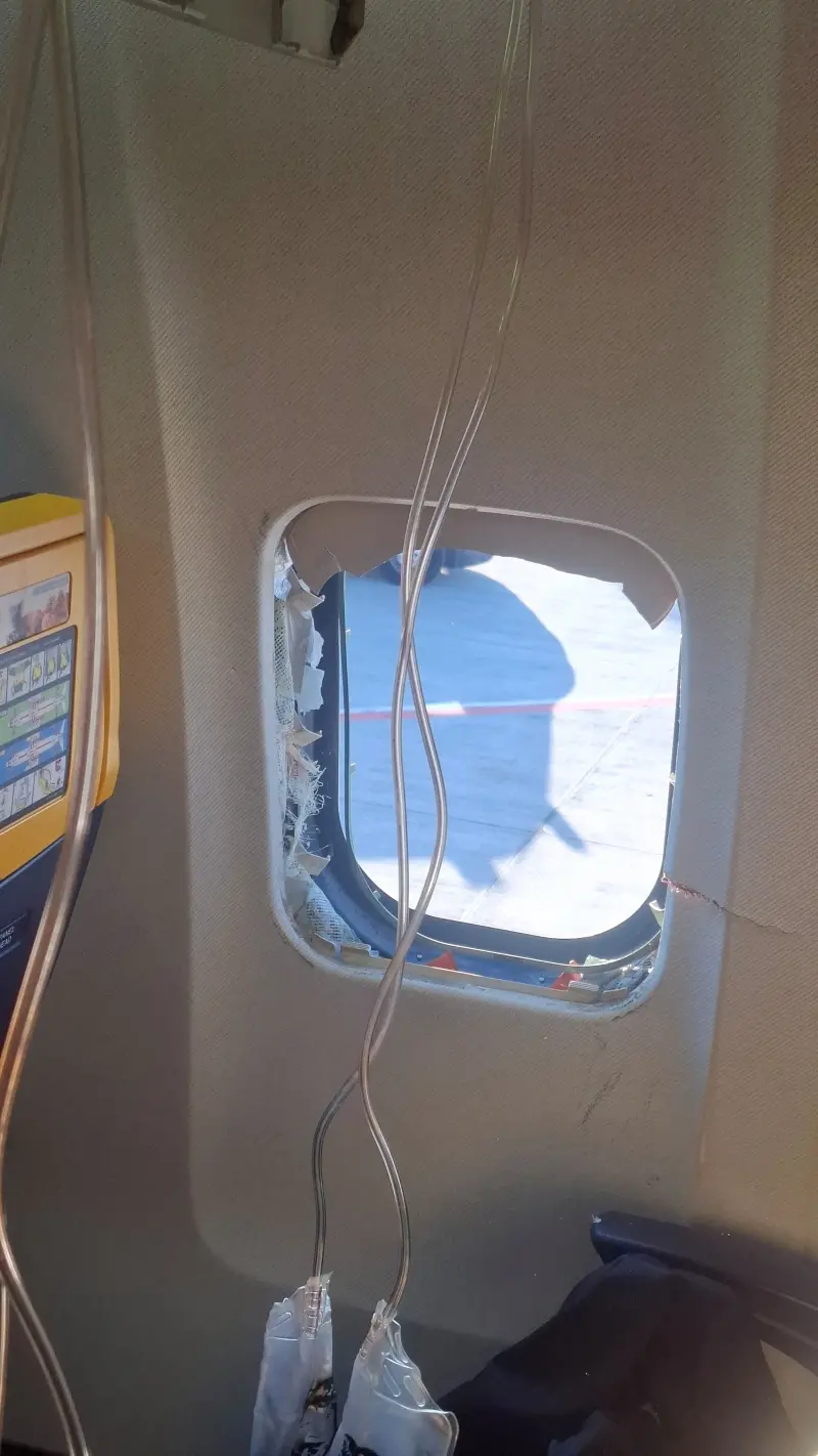 Man partially sucked out of plane as broken engine smashes window