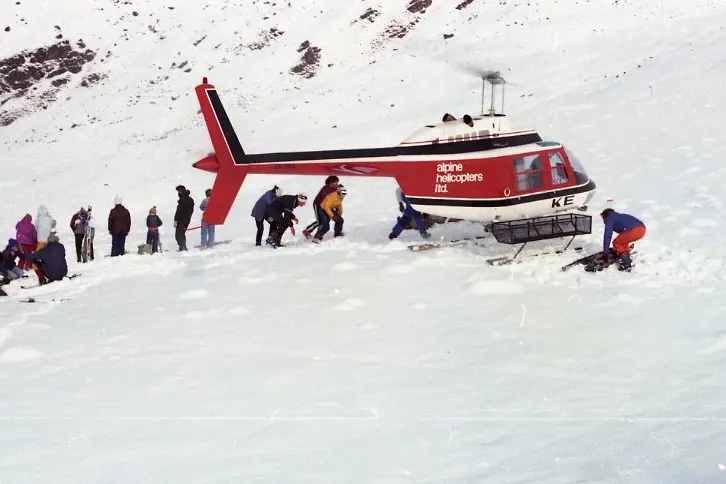 A helicopter prepares to take skiers to the original towrope operating at Cardrona skifield. Photo: W\\u0101naka\\u00A0History