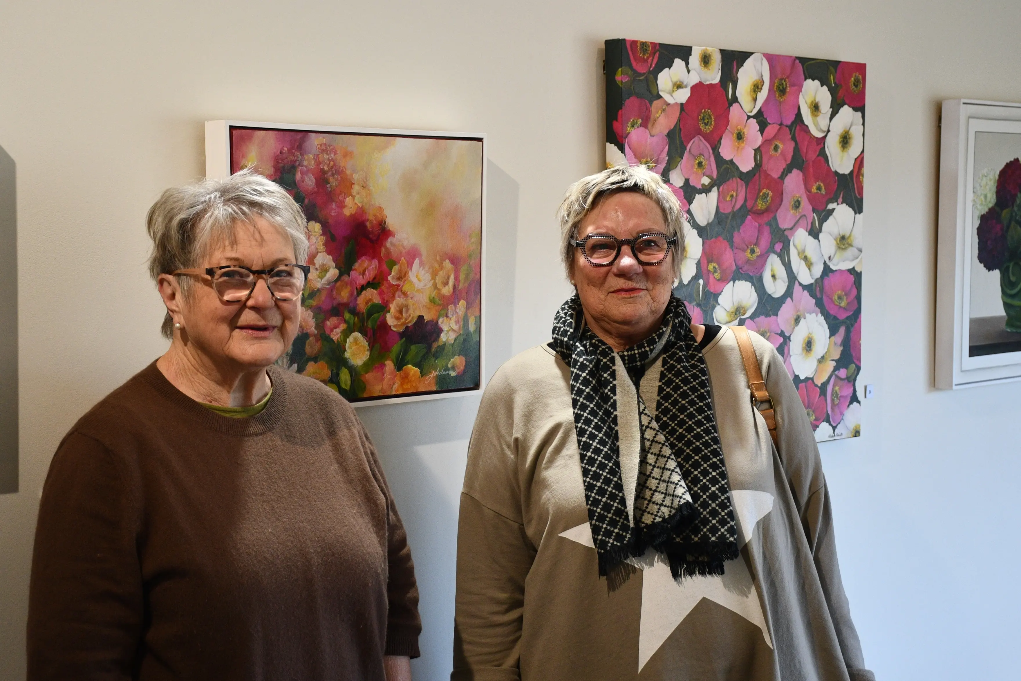 Almost 20 rosy paintings crafted by Julie Duncan (left) and Helen Keith are on show at the Croydon Aviation Heritage Centre gallery, in Mandeville, until the end of August. Photo: Gemma Sinclair
