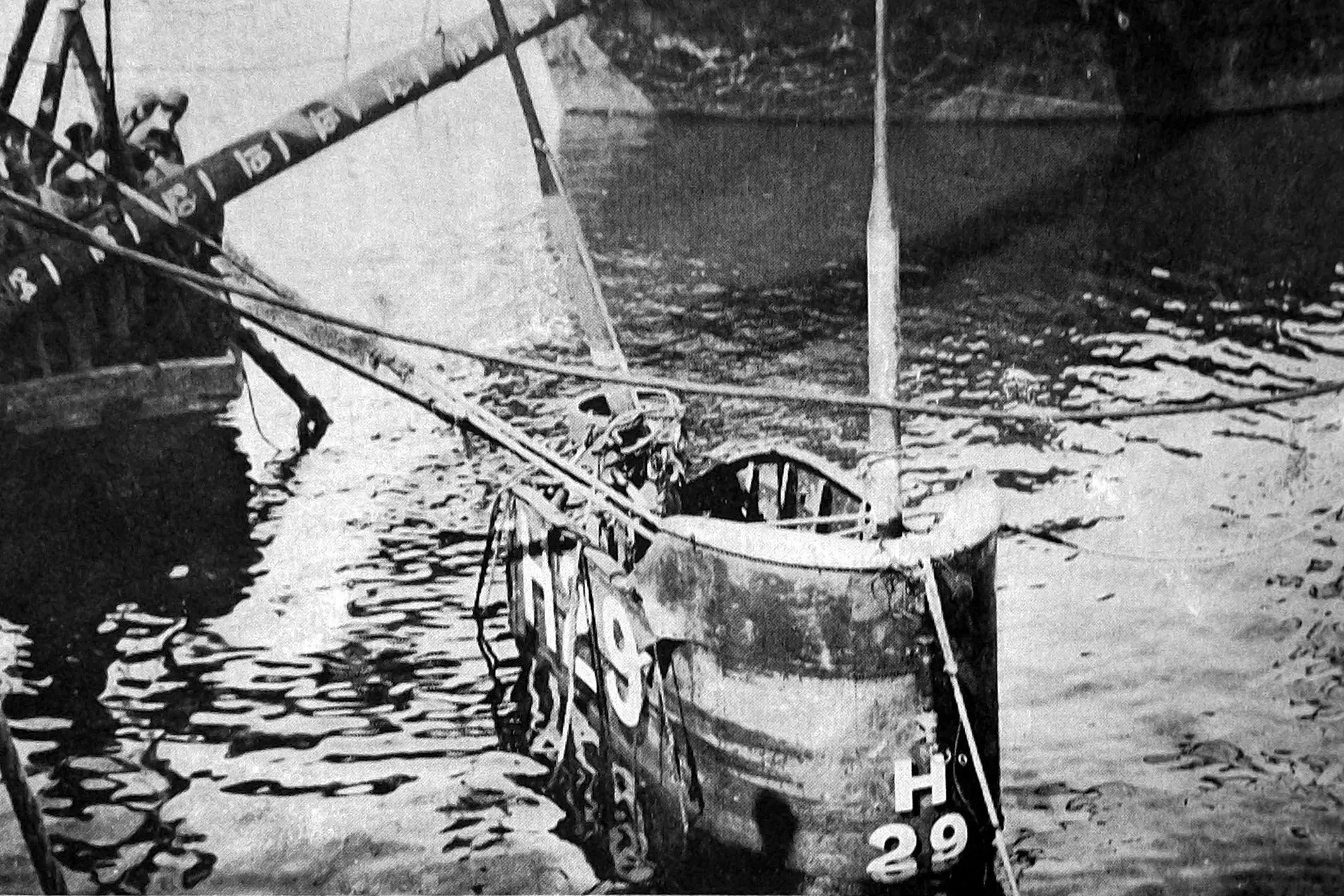 The conning tower and periscope of Royal Navy submarine HMS <i>H29</i>, which sank at Devonport Dockyard, southern England with the loss of six lives. She was raised inch by inch. Photo: Otago Witness, issue 3787, October 19, 1926, page 42