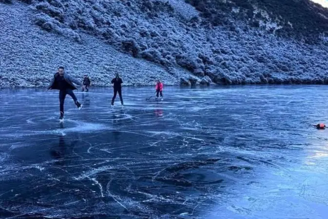 Ice skaters enjoying Canterbury\\'s frozen-over little Lake Ida this month. Photo: Supplied / Natural Ice Canterbury
