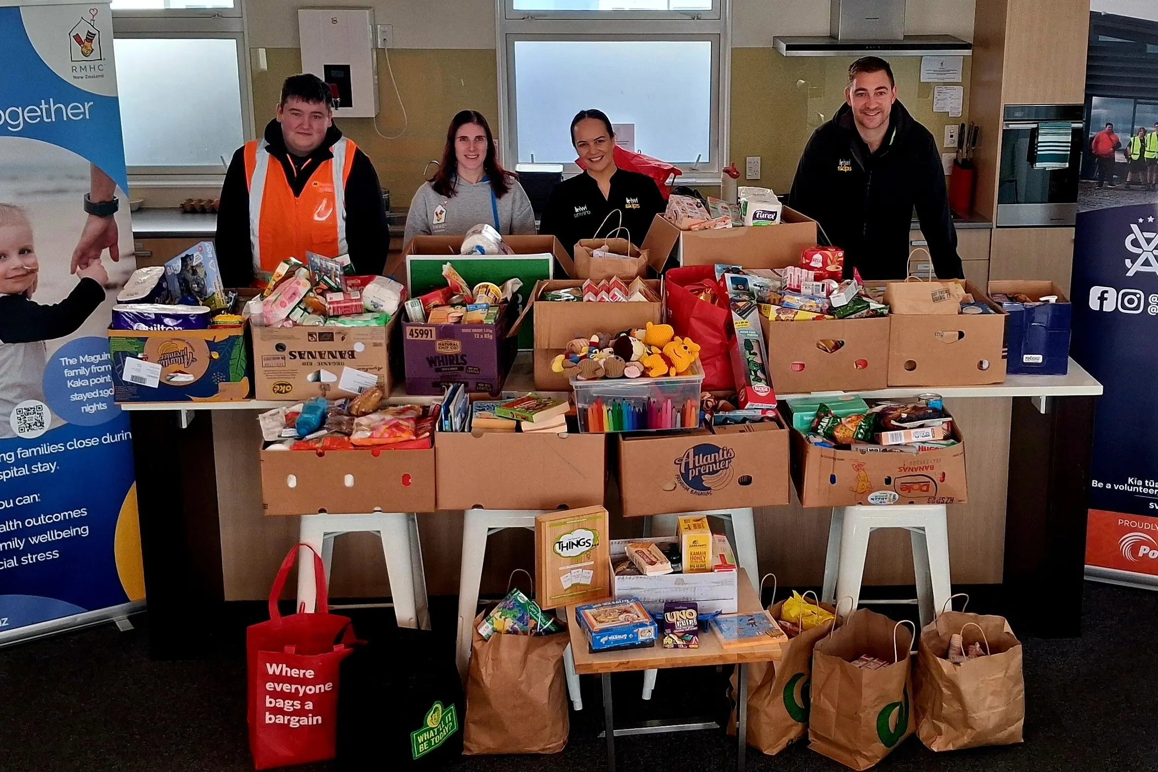 Admiring the collection of groceries and other items given during the Southland Volunteer Army drive for the Ronald McDonald Family Room at Southland Hospital are (from left) army major events and communication lead Jacob Wilkinson-Hall, family room community engagement advisor Katelyn Herman and Kiwi Skips owners Kereana and Daniel Butterfield. Photo:Supplied