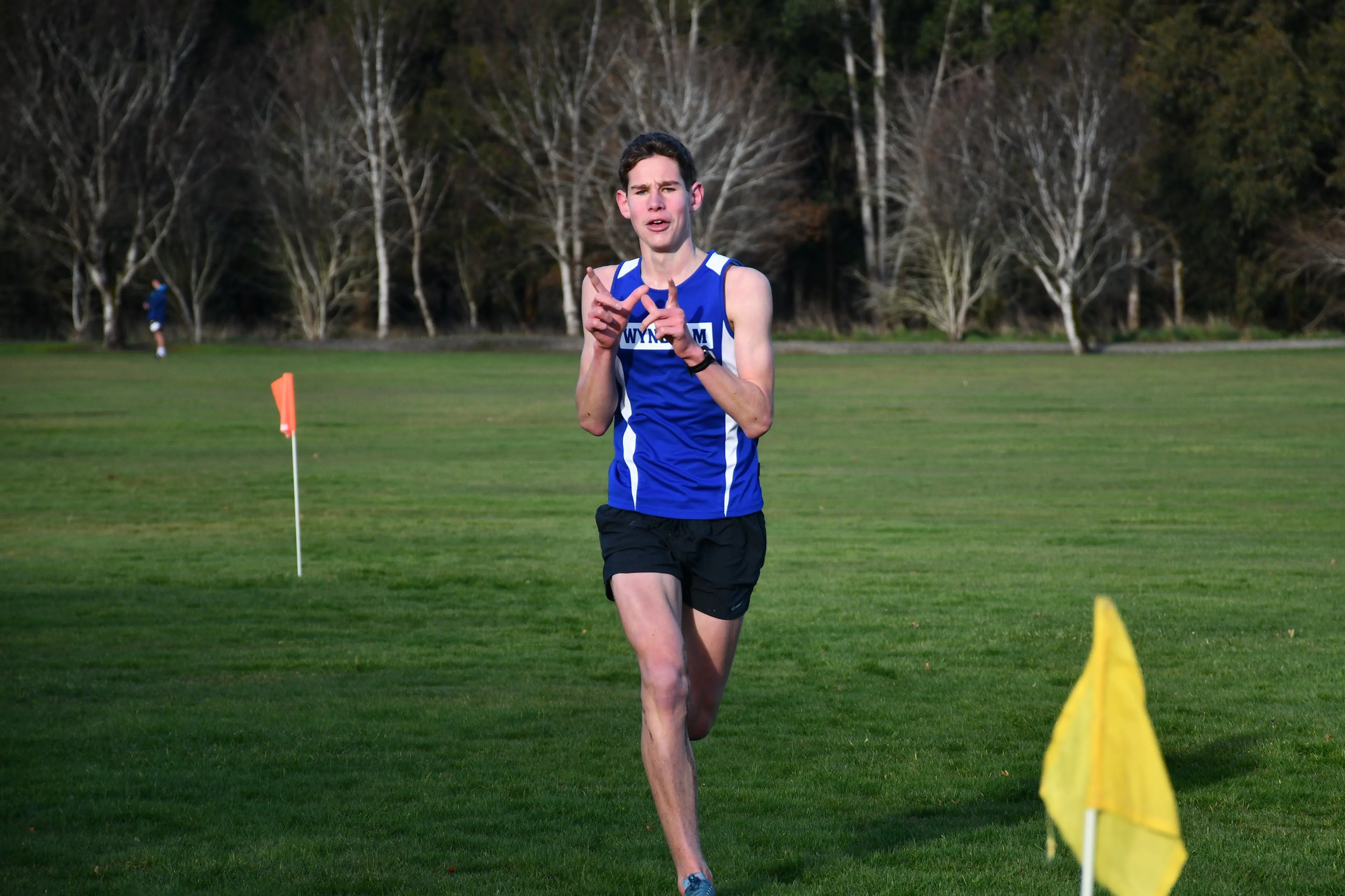 Menzies College head boy Hudson Roy, 17, proudly crosses the finish line representing Wyndham after running in the Gore Harriers\\' Cross-Country race on Saturday. Photo: Gemma Sinclair