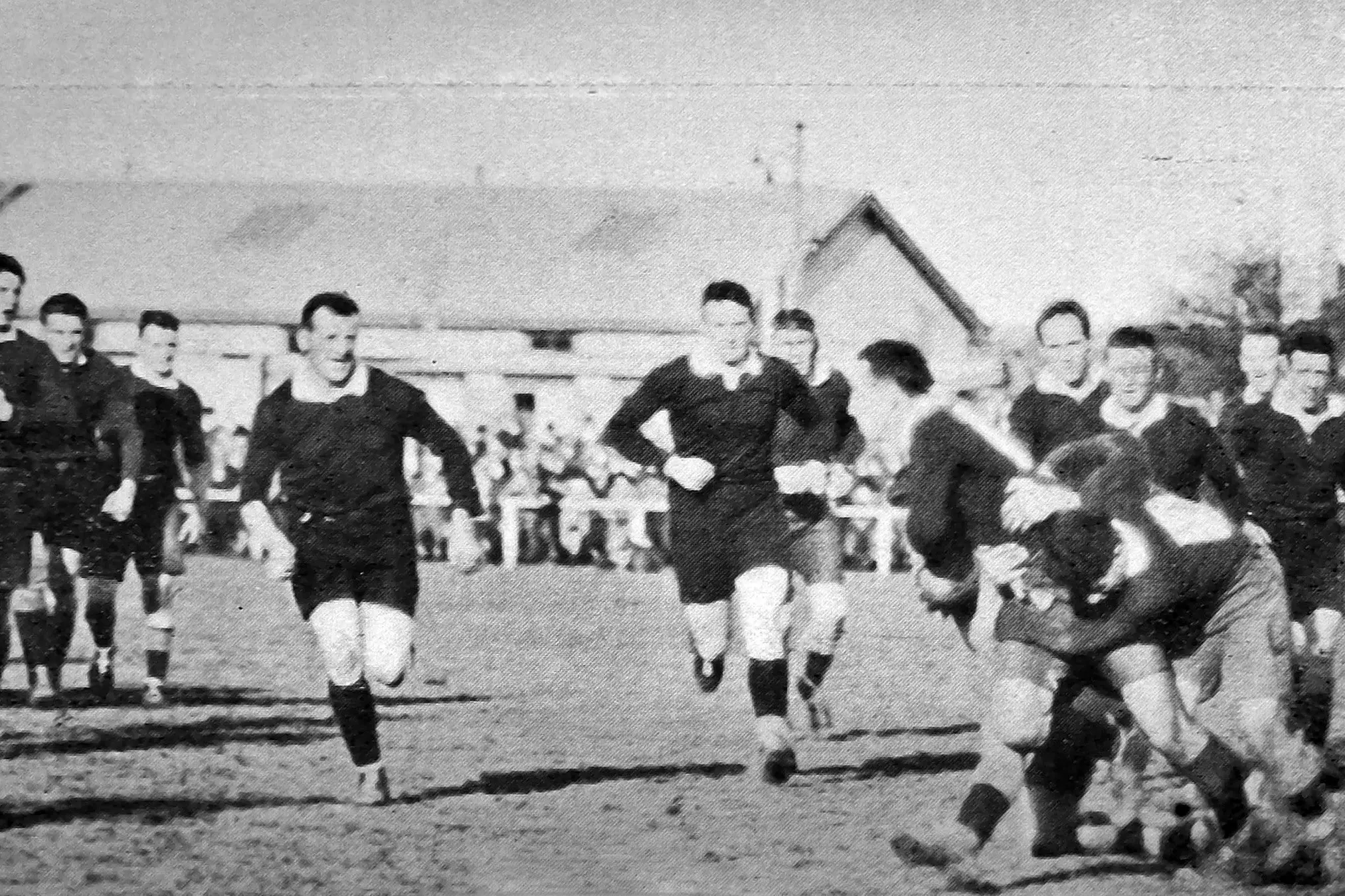 Otago v Southland interprovincial Rugby at Dunedin: Lewis (Otago wing forward) well tackled. Photo: \"Otago Witness\" issue 3780, August 24, 1926, page 45