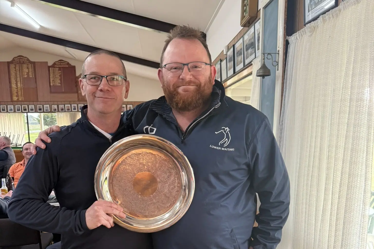 Lower Waitaki Golf Club captain Robbie Breen (right), pictured here presenting a trophy to Russell Bond, has been recognised for his volunteer work with the club. Photo: Supplied