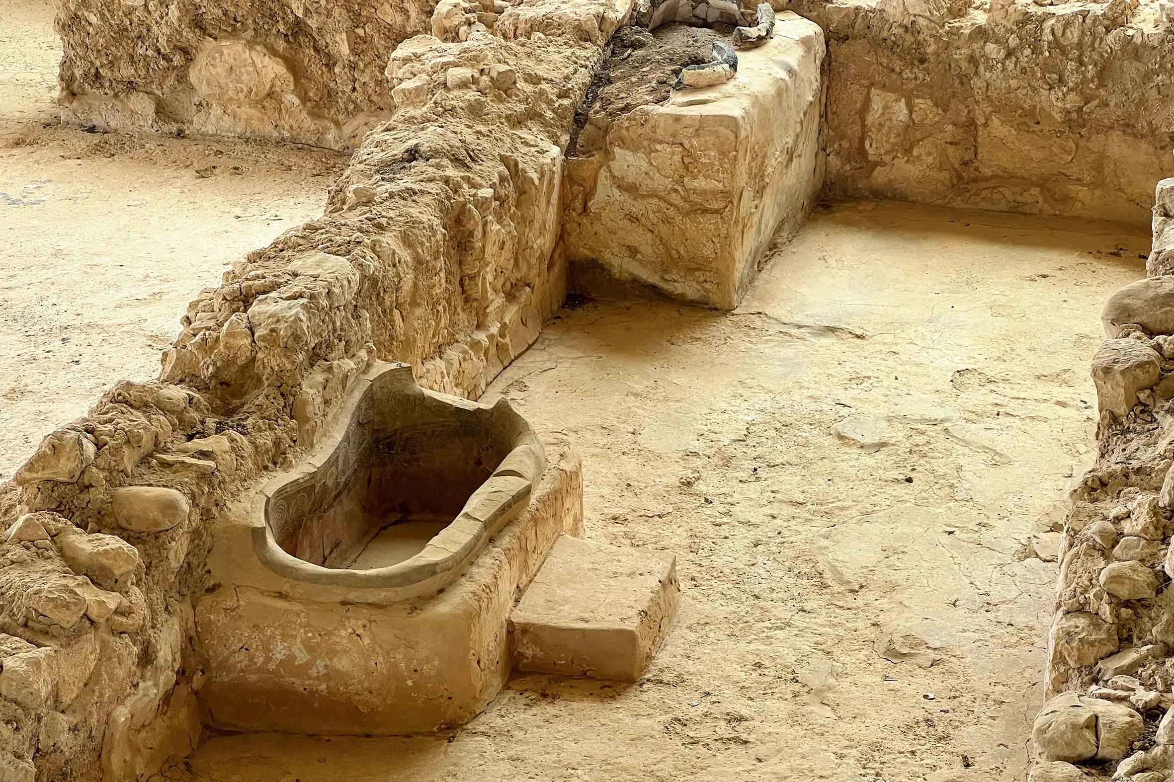 At Pylos, you can roam round the palace, including the bathroom built in about 1300 BC. The two pots at the far end were for storing water and aromatic oil and a step was provided for ease of access. Photo: Tom Higham