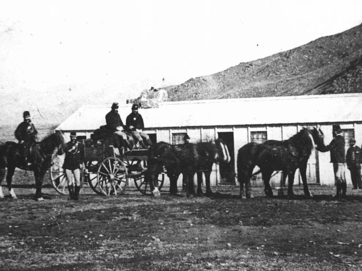 Armed gold escorts carried gold from the Otago goldfields to banks in Dunedin in the 1860s. This escort, armed with carbines, revolvers and sabres, is leaving Clyde in Central Otago for Dunedin. Photo: Hocken Digital Collections, Ref: NEG/SHEET24/4/6