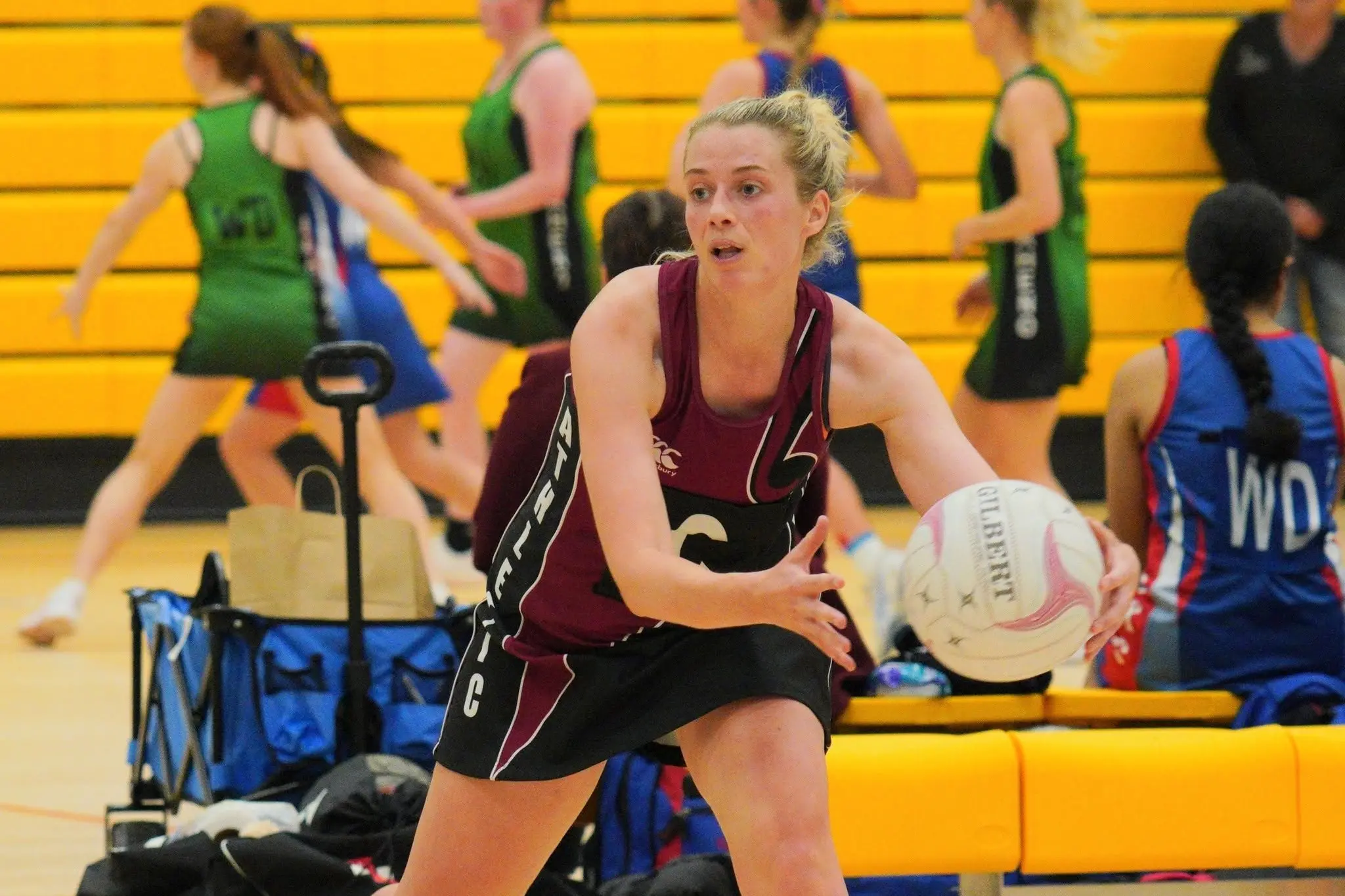 Blayze Tisdall looks to pass the ball for Athletic. Photo: Yammie Mckenzie Photography