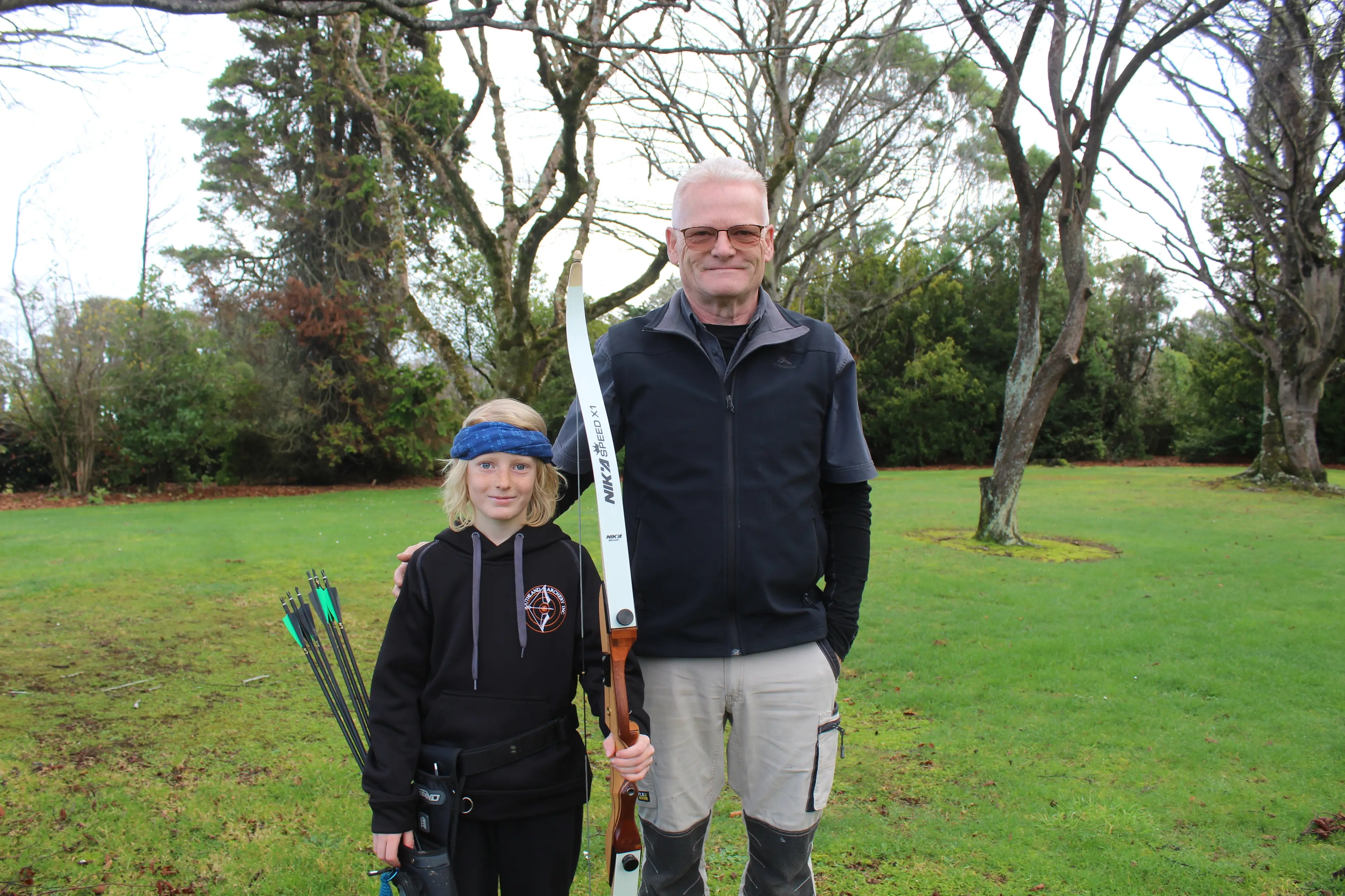 Young archery upstart Levi Harrison with his coach and grandfather Kirk Lawry. Photo: Tayler Mutton